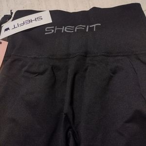 SHEFIT leggings size small with hair tie and laundry bag